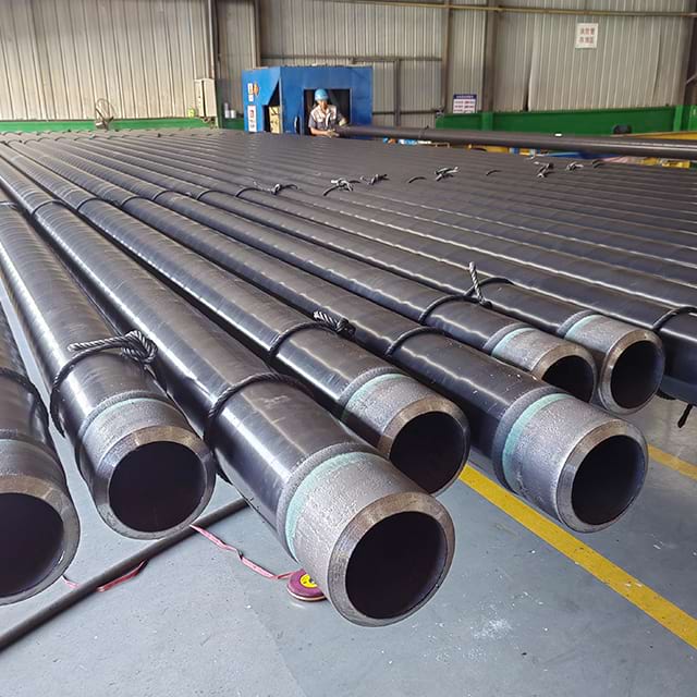 Bundles of black-coated line pipe with beveled ends