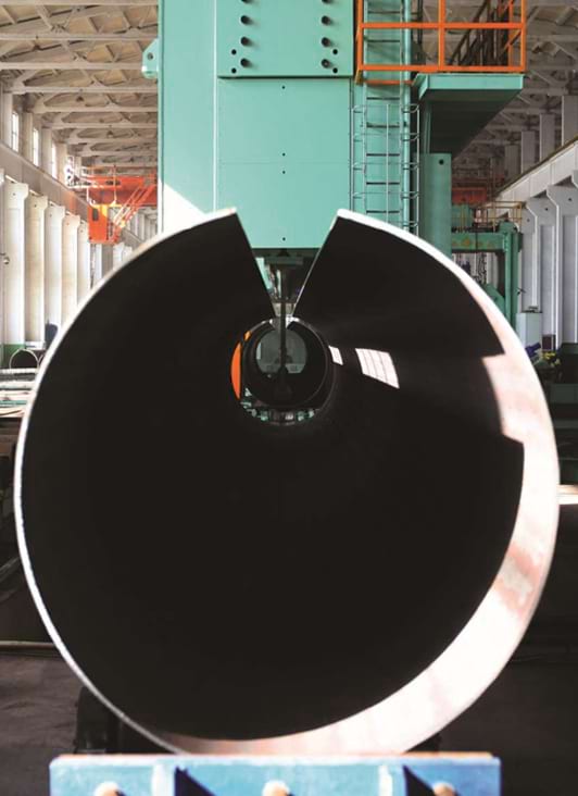 End-on view of a JCOE/LSAW open-O formed large-diameter pipe in a forming press